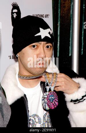 Famed Japanese DJ/musician and designer Nigo poses to photographers at the opening of his new store 'A Bathing Ape', hosted by Pharrell Williams at Soho, New York City on Tuesday, January 11, 2005. Photo by Slaven Vlasic/ABACA. Stock Photo