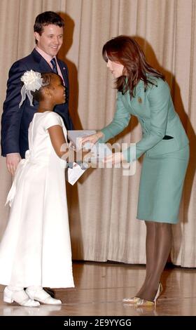 Reagan Walker (8 y.o.) is awarded (for her story telling skills) an invitation to attend the Hans Christian Andersen bicentenial celebrations in Copenhagen, Denmark by HRH Crown Prince Frederik of Denmark and his wife Crown Princess Mary of Denmark (Mary Elizabeth Donaldson) as they visited PS 144 Hans Christian Andersen Public School in Harlem, on the third day of their official visit to New York, on Tuesday, February 1, 2005. (Pictured : Frederik of Denmark, Mary of Denmark, Mary Donaldson, Reagan Walker). Photo by Nicolas Khayat/ABACA. Stock Photo