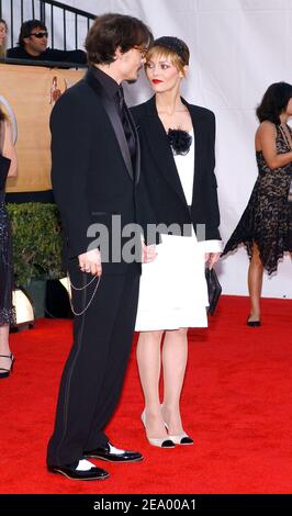 Johnny Depp and his girlfriend Vanessa Paradis arrive at the 11th Annual Screen Actors Guild Awards ceremony, held at the Shrine auditorium in Los Angeles, on Saturday, February 5, 2005. Photo by Nicolas Khayat/ABACA. Stock Photo