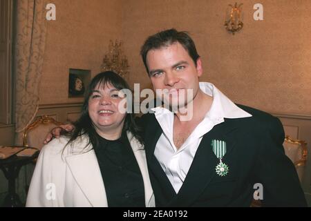 French actor Clovis Cornillac poses with his mother, French actress Myriam Boyer, after he has been awarded with the Order of Chevalier des Arts et des Lettres during a ceremony at Theatre Dejazet in Paris, France, on February 8, 2005. Photo by Laurent Zabulon/ABACA. Stock Photo