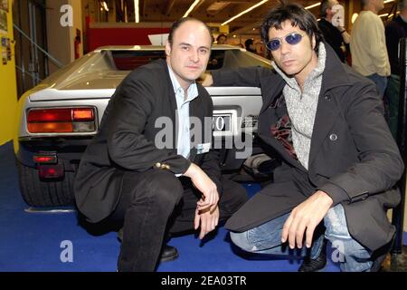 EXCLUSIVE. French singer Jean-Luc Lahaye (R) poses with luxuary cars collecter Stephane Poux at the Detomaso stand during the exhibition 'Retromobile' held at the Parc des Expositions in Paris, France on February 20, 2005. Photo by Benoit Pinguet/ABACA. Stock Photo