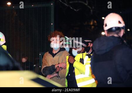 London, UK. 6th February, 2021. Lazer, one of the young tunnellers leaves the tunnel voluntarily on day ten of the Euston Square HS2 protest camp evictions, London, Saturday 6th February 2020 Credit: Denise Laura Baker/Alamy Live News Stock Photo