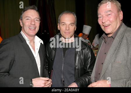 (L-R) Club manager Tony Gomez, French TV presenter and actor Laurent Baffie and French director Yves Boisset attend a party to celebrate French boxer Brahim Asloum's victory against Spaniard Jose-Antonio Lopez-Bueno in the European Flyweight Championship, at L'Etoile in Paris, France, on March 14, 2005. Photo by Benoit Pinguet/ABACA. Stock Photo