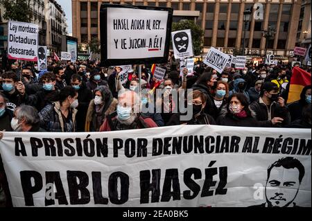 Madrid, Spain. 06th Feb, 2021. Protesters with placards during a demonstration to protest against the Spanish National Court's decision to sentence Catalan rapper Pablo Hasel for some song lyrics and tweets criticizing the Spanish Monarchy, the rapper was convicted and given ten days to enter prison. Credit: Marcos del Mazo/Alamy Live News Stock Photo