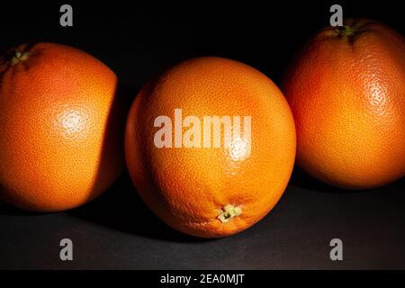 grapefruit group on black background Stock Photo
