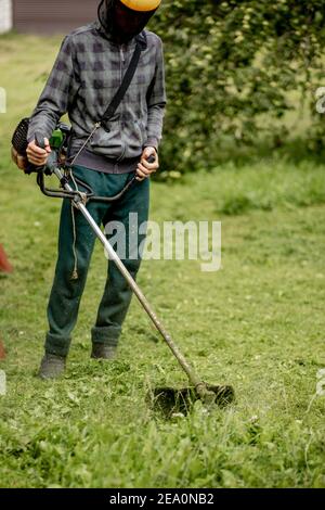 Gardening, man mowing the lawn Stock Photo by ©runzelkorn 20428577