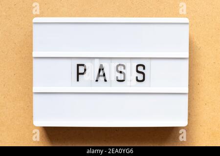 Lightbox with word pass on wood background Stock Photo