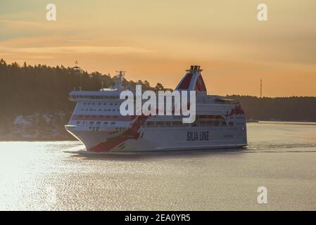 STOCKHOLM ARCHIPELAGO, SWEDEN - MARCH 09, 2019: Tourist cruise ferry 'Baltic Princess' at sunrise in the Stockholm archipelago Stock Photo