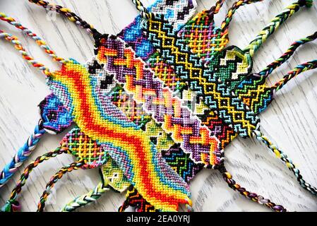 Two woven DIY friendship bracelets with alpha patterns Space Stock Photo -  Alamy