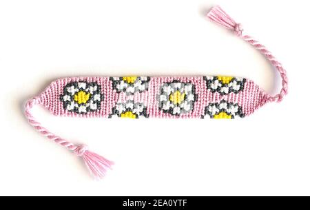 Two woven DIY friendship bracelets with alpha patterns Space Stock Photo -  Alamy