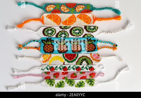 Two woven DIY friendship bracelets with alpha patterns Space Stock Photo -  Alamy