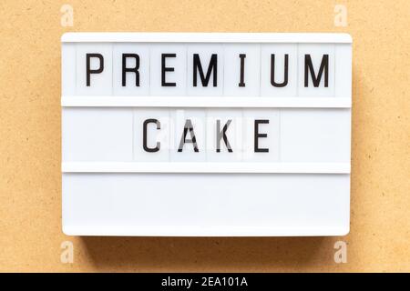 Lightbox with word premium cake on wood background Stock Photo