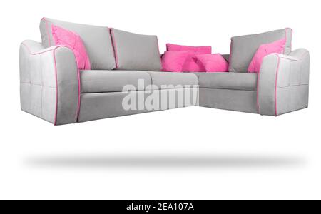 Gray sofa with pink  pillows isolated on a white background. Gray sofa isolated over white with clipping path. Stock Photo