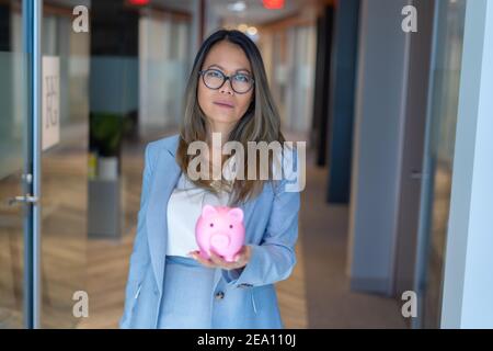 Employees celebrating business success with paper money Stock Photo