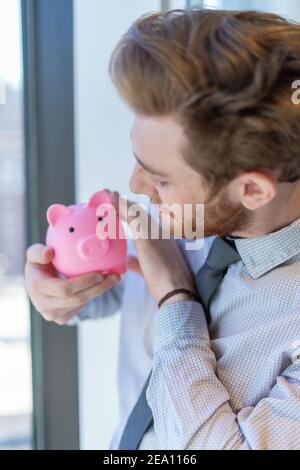 Employees celebrating business success with paper money Stock Photo