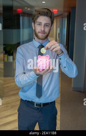 Employees celebrating business success with paper money Stock Photo