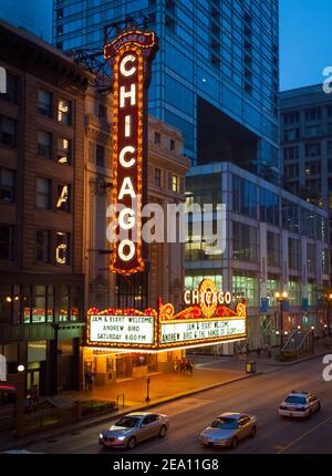 The brilliant, iconic marquee of the Chicago Theatre at night with people on North State Street in downtown Chicago, Illinois. Stock Photo