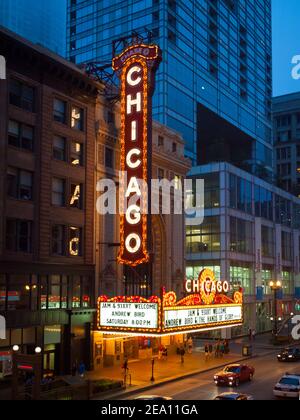 The brilliant, iconic marquee of the Chicago Theatre at night with people on North State Street in downtown Chicago, Illinois. Stock Photo