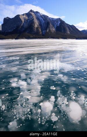 Frozen lake with interesting bubbles and patterns. Stock Photo