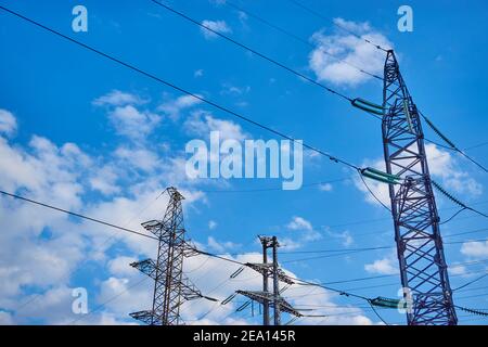 High voltage post tower sky background with clouds Stock Photo