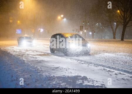 Bielefeld, Germany. 07th Feb, 2021. Cars drive over a snow-covered road. Credit: Marcel Kusch/dpa/Alamy Live News Stock Photo