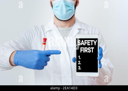 Writing note showing Safety First. Business concept for Avoid any unnecessary risk Live Safely Be Careful Pay attention Laboratory Blood Test Sample S Stock Photo