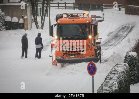 Haltern, NRW, Germany. 07th Feb, 2021. A snow plow clears a road on Sunday morning. A severe weather warning is in place in North Rhine-Westphalia and other parts of Germany after storms, up to 30cm of snow fell overnight and on Sunday morning. The severe weather is set to continue. Credit: Imageplotter/Alamy Live News Stock Photo
