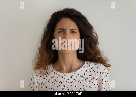 Portrait of unhappy woman distressed with bad news Stock Photo