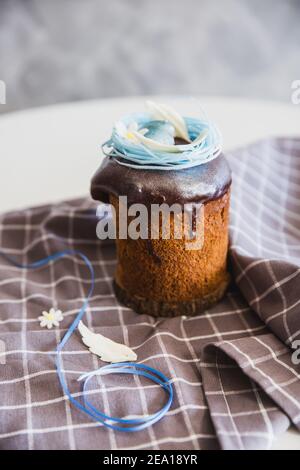 Easter Cakes decorated with nest and eggs - Traditional Kulich, Paska Easter Bread. Traditional Easter spring Stock Photo