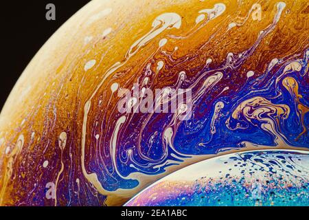 Fluid art made of colorful soap bubble film. Trendy Inkscape blurred background. Alien space planets art. Stock Photo