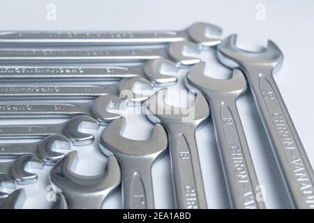 Cut-out wrenches horizontally placed from the biggest to the smallest in a row. Hand tool. Tools for carpentry work. Type of fastener. Mend and repair Stock Photo