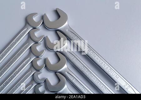 Cut-out wrenches horizontally placed from the biggest to the smallest in a row. Hand tool. Tools for carpentry work. Type of fastener. Mend and repair Stock Photo