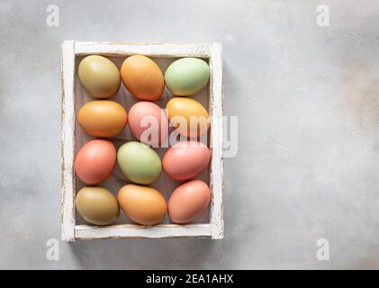 flat lay composition with Easter eggs in white wooden box Stock Photo