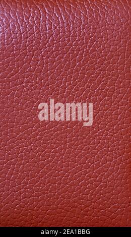 Crimson red colored cow leather surface for abstract background Stock Photo