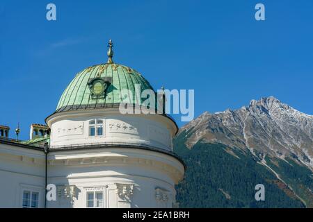 Innsbruck, Austria- october 11, 2019:  Green dome of the Kaiserliche Hofburg (imperial palace) in Innsbruck Austria against the mountain view Stock Photo