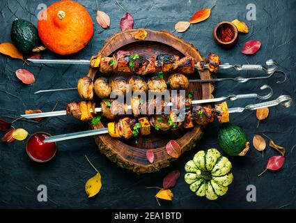 Kebabs or skewers of meat and pumpkin.Delicious fried meat on skewers Stock Photo