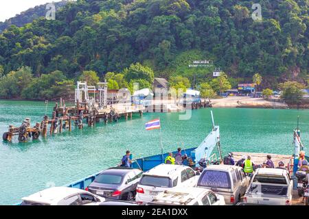 Trat, Thailand - 01/11/2020: ferry approaches the pier on the island of Koh Chang Stock Photo