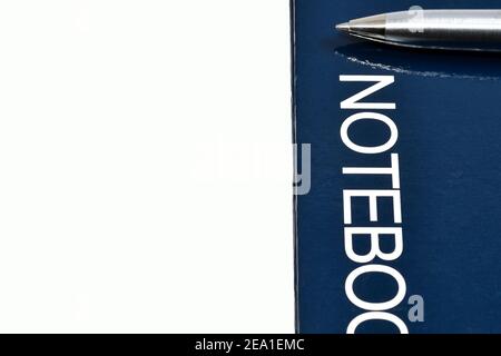 Close up view of a pen on the cover of a hard cover notebook. No people, Copy space. Stock Photo