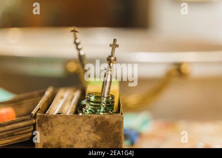 Orthodox faith. Baptismal procedure in the church. Equipment for anointing a child at baptism. Pray for people life. Pray to god Stock Photo