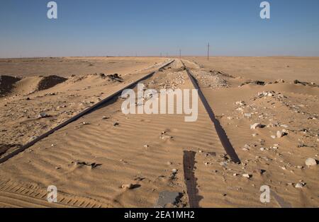 Abandoned railway tracks in egyptian desert Stock Photo
