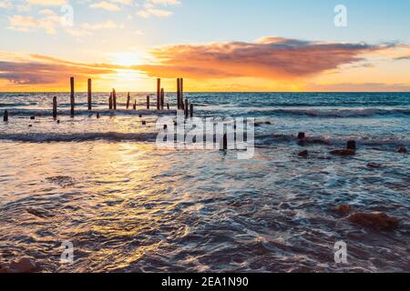 Iconic Port Willunga jetty ruins at sunset, South Australia Stock Photo