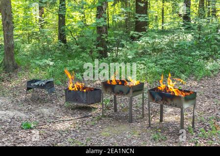 Fire from burning wood in grill Stock Photo