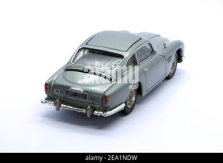 Photo of a Silver die cast model of the Aston Martin DB5 famously used in the Sean Connery James Bond 007 movie Goldfinger in 1964 rear view Stock Photo