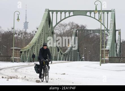 Potsdam, Germany. 07th Feb, 2021. A cyclist is cycling from Glienicke Bridge towards the city centre. Credit: Soeren Stache/dpa-Zentralbild/ZB/dpa/Alamy Live News Stock Photo