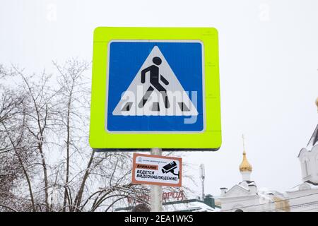 ZVENIGOROD, MOSCOW REGION, RUSSIA – FEBRUARY 13, 2019: Pedestrian crossing sign. Below the inscription in Russian: "Attention is video surveillance. T Stock Photo