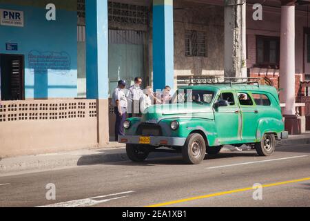 HAVANA,CUBA - 03 06 2013: Police officers in front of a police station on a street in Havana Stock Photo