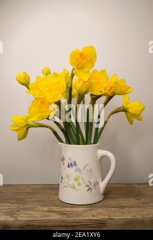 Bunch of daffodils in a jug Stock Photo