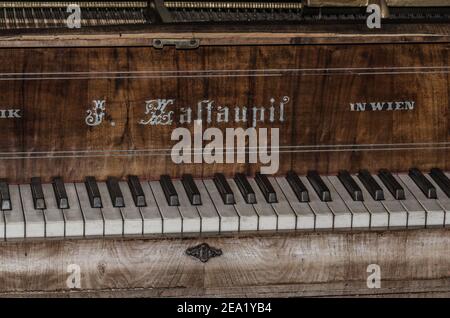 old piano in an abandoned house Stock Photo