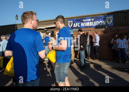 AFC Wimbledon fans drinking beer before the game at AFC Wimbledon football club, England. Stock Photo