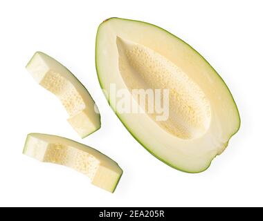 Sliced green papaya without seeds isolated with clipping path on white background. Asian food, top view Stock Photo